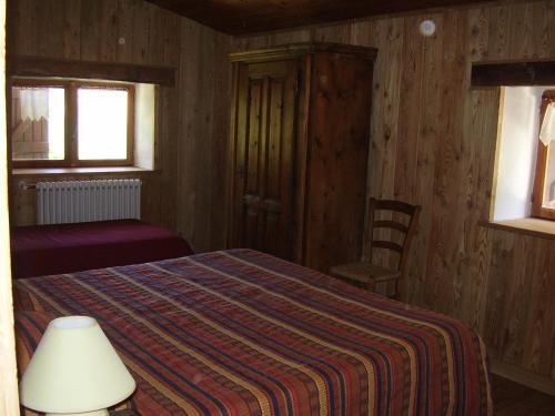 מיטה או מיטות בחדר ב-Hotel Camping Grivola