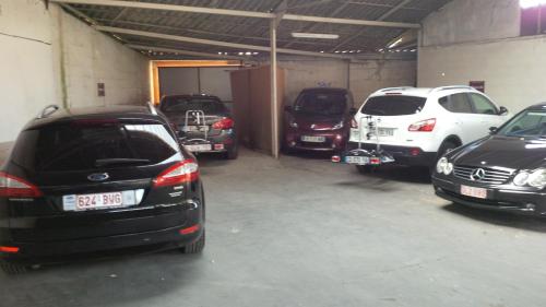 a group of cars parked in a garage at Bordeaux Cosy B&B in Bordeaux