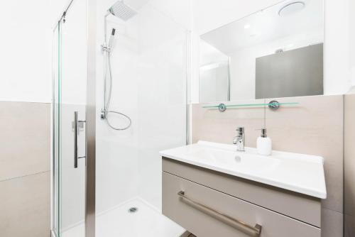 a bathroom with a sink and a shower at Kawarau View in Queenstown
