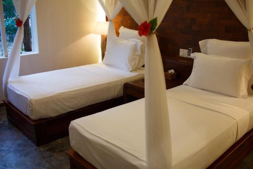 Ένα ή περισσότερα κρεβάτια σε δωμάτιο στο The Trang Villas
