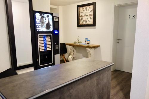 a barbershop with a soda machine in a room at Hotel Seeadler in Friedrichshafen