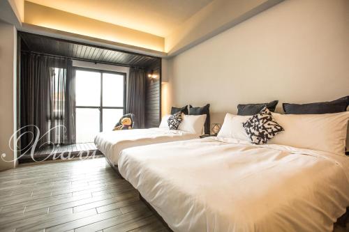 Postel nebo postele na pokoji v ubytování Xia Bi Garden Wedding B&B