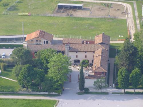 an aerial view of a building with trees and a field at Agriturismo Al Casale in Codroipo