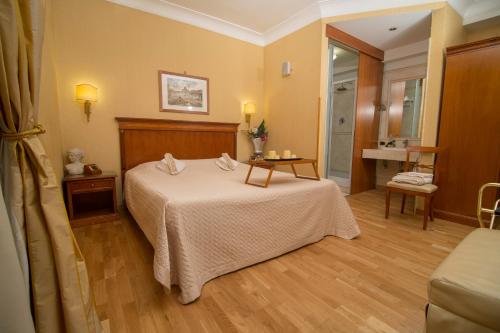 Postel nebo postele na pokoji v ubytování Luxury Rooms H 2000 Roma