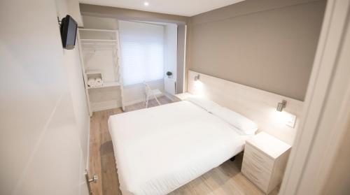 Postel nebo postele na pokoji v ubytování Happy Hostal Carrales