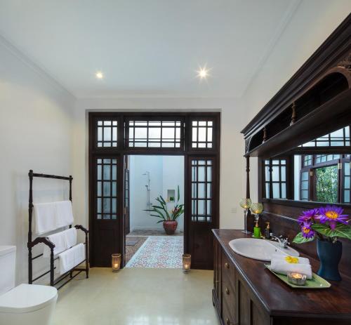 a bathroom with a sink and a toilet at Villa Abiman in Dickwella
