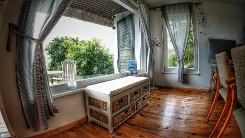 a room with a large window with a mattress in front of it at Haus am Hügel in Groß Zicker