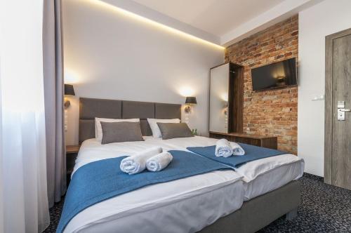 Katil atau katil-katil dalam bilik di Liberum Residence Old Town