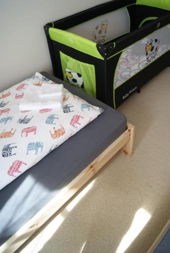 two twin beds in a room with ainylinylinylinylinylinylinylinyl at Przybobrze Apt. in Jelenia Góra