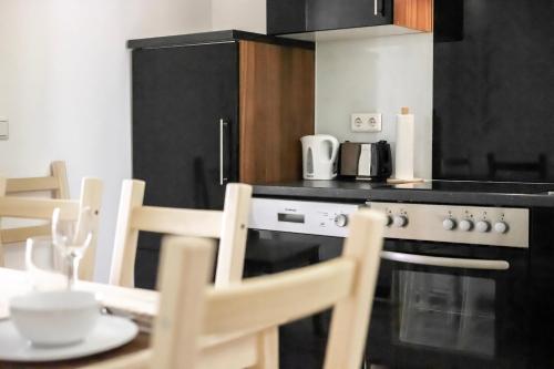 Kuchyň nebo kuchyňský kout v ubytování Vienna City Apartments Brigittenau