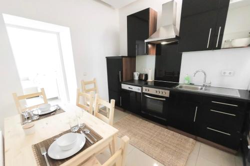 Kuchyň nebo kuchyňský kout v ubytování Vienna City Apartments Brigittenau