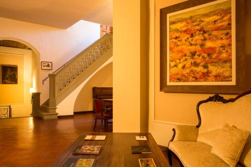 a living room with a couch and a table at Art Hotel Villa Agape - Place of Charme in Florence