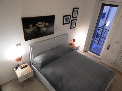 a bedroom with a large bed and a window at Seventy in Sperlonga