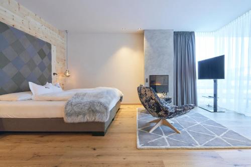 Ένα ή περισσότερα κρεβάτια σε δωμάτιο στο Hotel Cristallo - Wellness Mountain Living