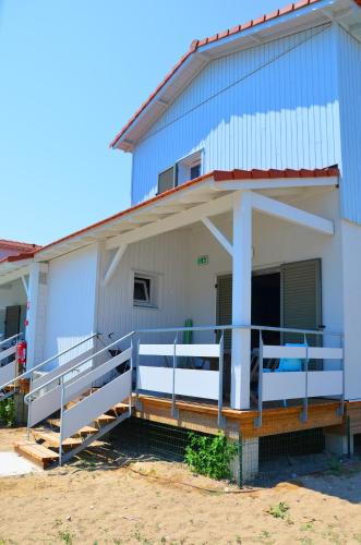 a large building with a ramp in front of it at Lagrange Grand Bleu Vacances – Résidence La Grenadine in Marseillan