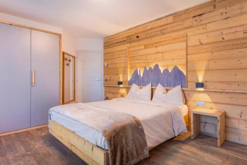 เตียงในห้องที่ Residence Mille Montagne