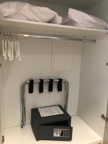a bunk bed with a scale in a room at Droushia Heights Hotel in Droushia