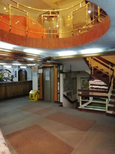 an empty room with a staircase in a building at Hotel La Joya in La Paz