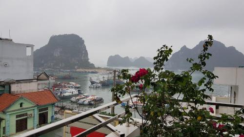 a view of a harbor with boats in the water at Hoàng Grand in Cái Rồng