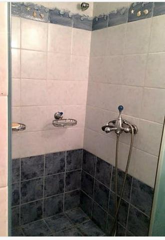 a shower in a bathroom with a glass door at Nerantza Villa Jolimax in Nerántza