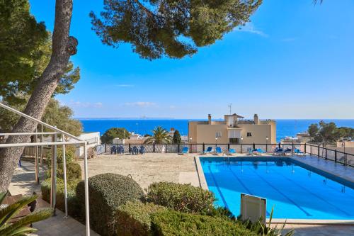 a villa with a swimming pool and the beach at MLL Blue Bay in Palma de Mallorca