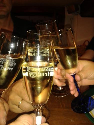 a group of people holding up glasses of wine at Kühn's Gästehaus in Pünderich