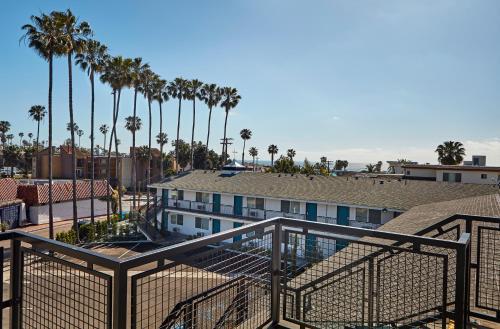 a view of a hotel with palm trees at The Shoal Hotel La Jolla Beach in San Diego