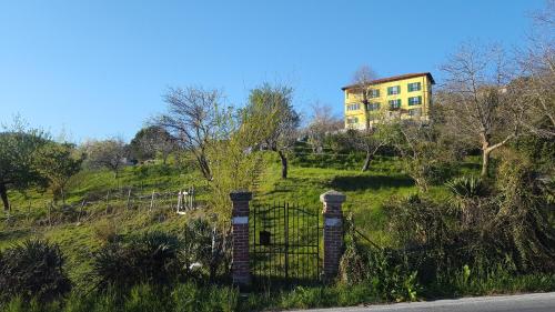 a house on the side of a hill with a gate at Villa Maria in Mignanego
