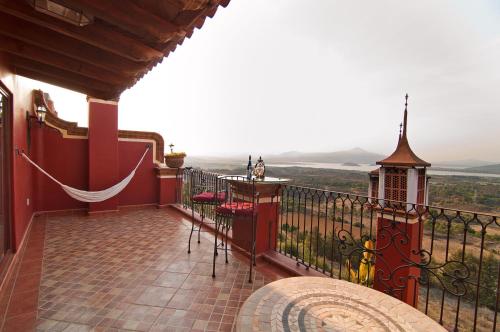 a balcony with a view of the countryside at Porton del Cielo in Pátzcuaro