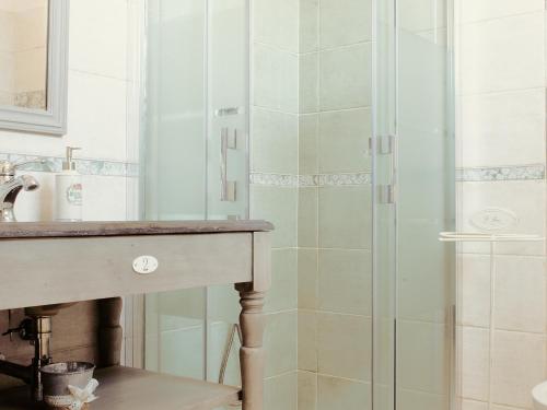 a bathroom with a sink and a shower at The Bell Tower Lodge in Palidoro
