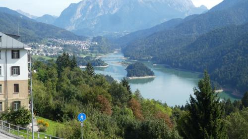 a view of a river in a valley with mountains at Hotel Belvedere Dolomiti in Pieve di Cadore