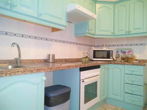 A kitchen or kitchenette at Bright spacious apartment, 2 min walk from beach