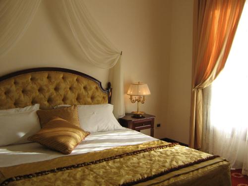 Кровать или кровати в номере Grand Hotel Palace