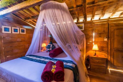 Ein Bett oder Betten in einem Zimmer der Unterkunft Villa Melasti Amed
