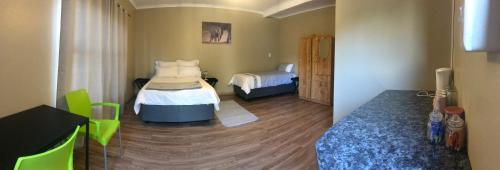 a bedroom with two beds in a room at 4 on Sirius in Polokwane