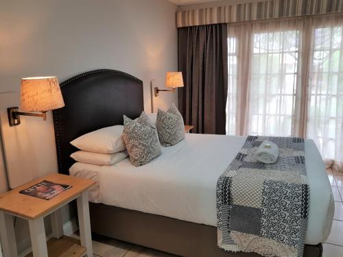 Ένα ή περισσότερα κρεβάτια σε δωμάτιο στο Shonalanga Lodge