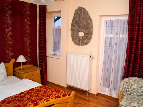 Cama ou camas em um quarto em Landhotel Furthmühle