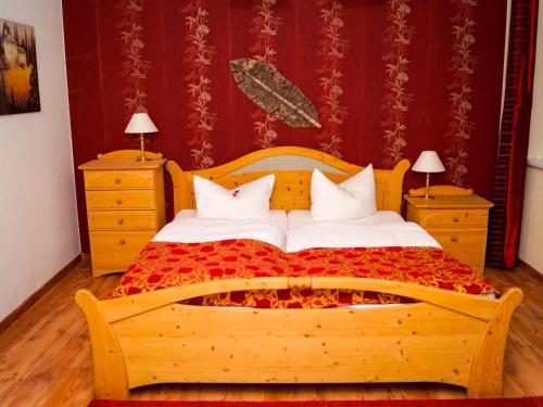 En eller flere senge i et værelse på Landhotel Furthmühle
