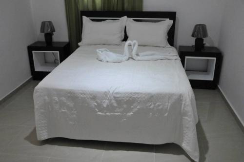 Ένα ή περισσότερα κρεβάτια σε δωμάτιο στο Hostal San Francisco de Asis