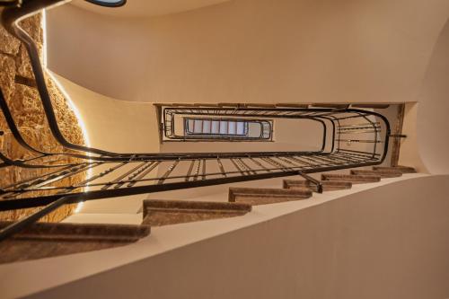 a staircase in a building with a light on it at Ca n'Alexandre - Adults Only in Palma de Mallorca