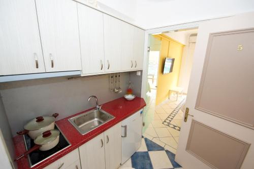 A kitchen or kitchenette at Napoleon On The Beach