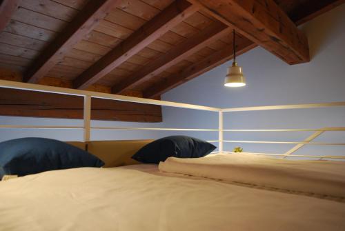 Giường trong phòng chung tại Agriturismo il Rovere