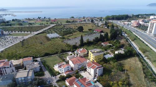 an aerial view of a city with houses and a highway at Villa Kovacevic in Bar