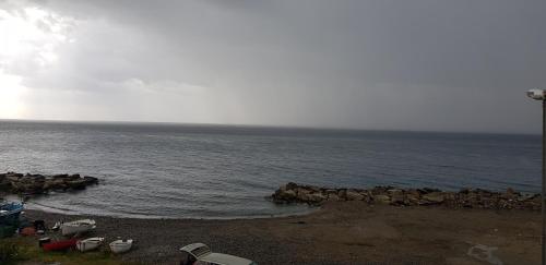 a group of boats on a beach near the water at La Casa Dei Sogni in Gallico