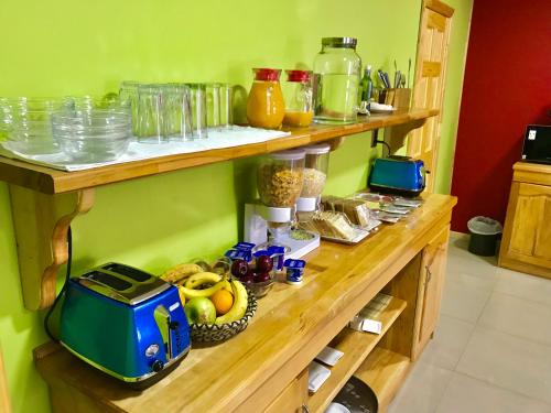 a counter with a bunch of food on it at Hostal Andes Patagónicos in Puerto Natales