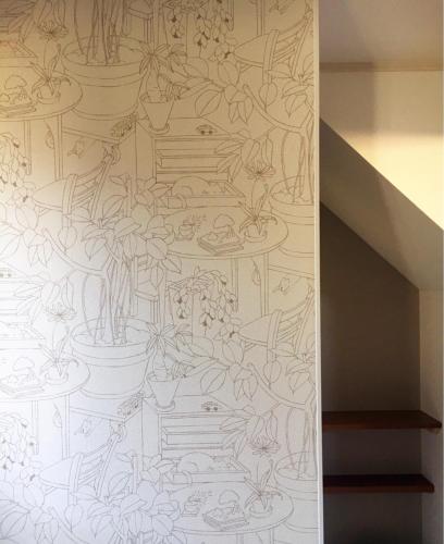 a drawing of potted plants on a wall at Stay Nikko Guesthouse in Nikko