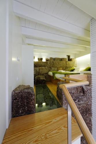 a room with a pond in the middle of a building at Guimarães Studios Lounge in Guimarães