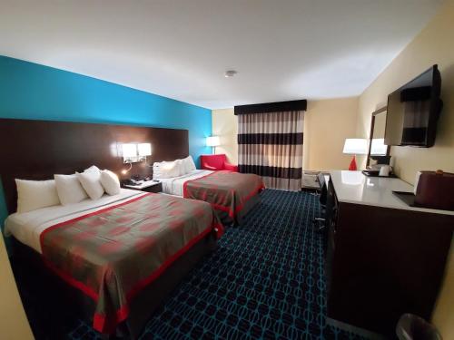 Ramada by Wyndham Groton Mysticにあるベッド