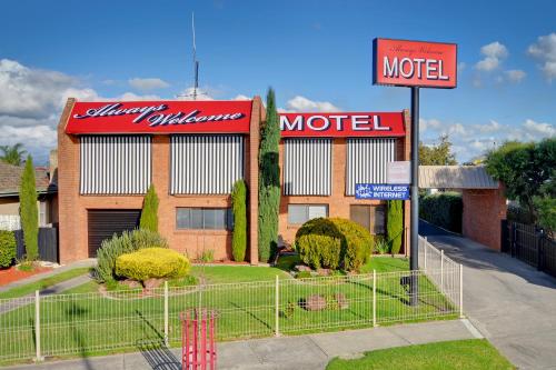 a motel sign in front of a building at Always Welcome Motel in Morwell