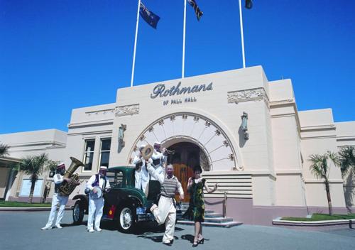 a group of people standing in front of a building at Quest Napier Serviced Apartments in Napier